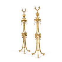 A pair of late George III carved giltwood torch&#232;res and candelabra, circa 1785-90