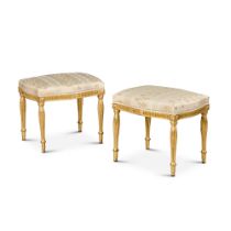 A pair of George III giltwood stools, circa 1780