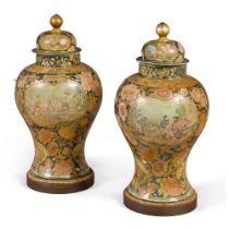 A pair of Piedmontese gilt and polychrome decorated papier-m&#226;ch&#233; covered vases on stands,