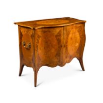 A George III mahogany, satinwood, marquetry and kingwood serpentine commode, Circa 1770 in the manne