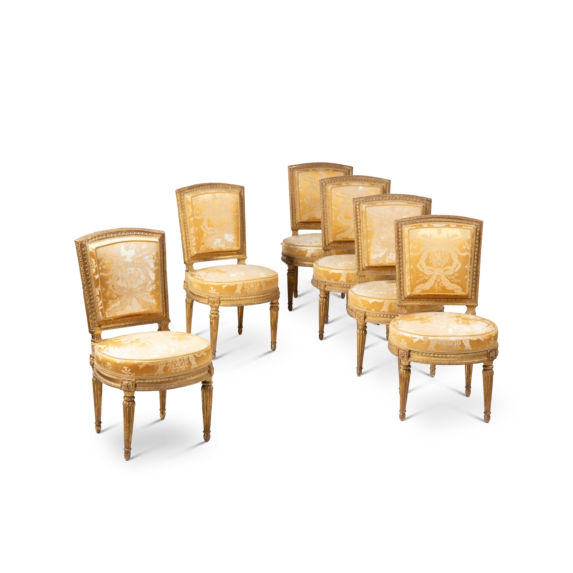 A suite of six Louis XVI giltwood chairs, stamped by Georges Jacob, the sculpture by Jean-Baptiste R