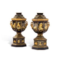 A pair of painted and gilt-metal covered urns, mid 19th century | Paire d'urnes couvertes en tole pe