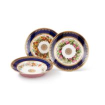 A pair of S&#232;vres (hard-paste) porcelain faux-lapis ground botanical dessert plates, circa 1824-