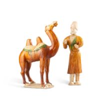 A sancai-glazed pottery figure of a camel and A sancai-glazed pottery figure of a groom, Tang dynast