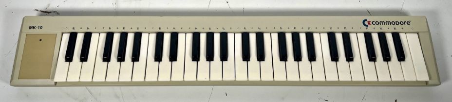 Commodore MK-10 MIDI Keyboard (E) Untested. We have no information about the functional status of