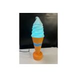 Illuminated ice cream cone display.