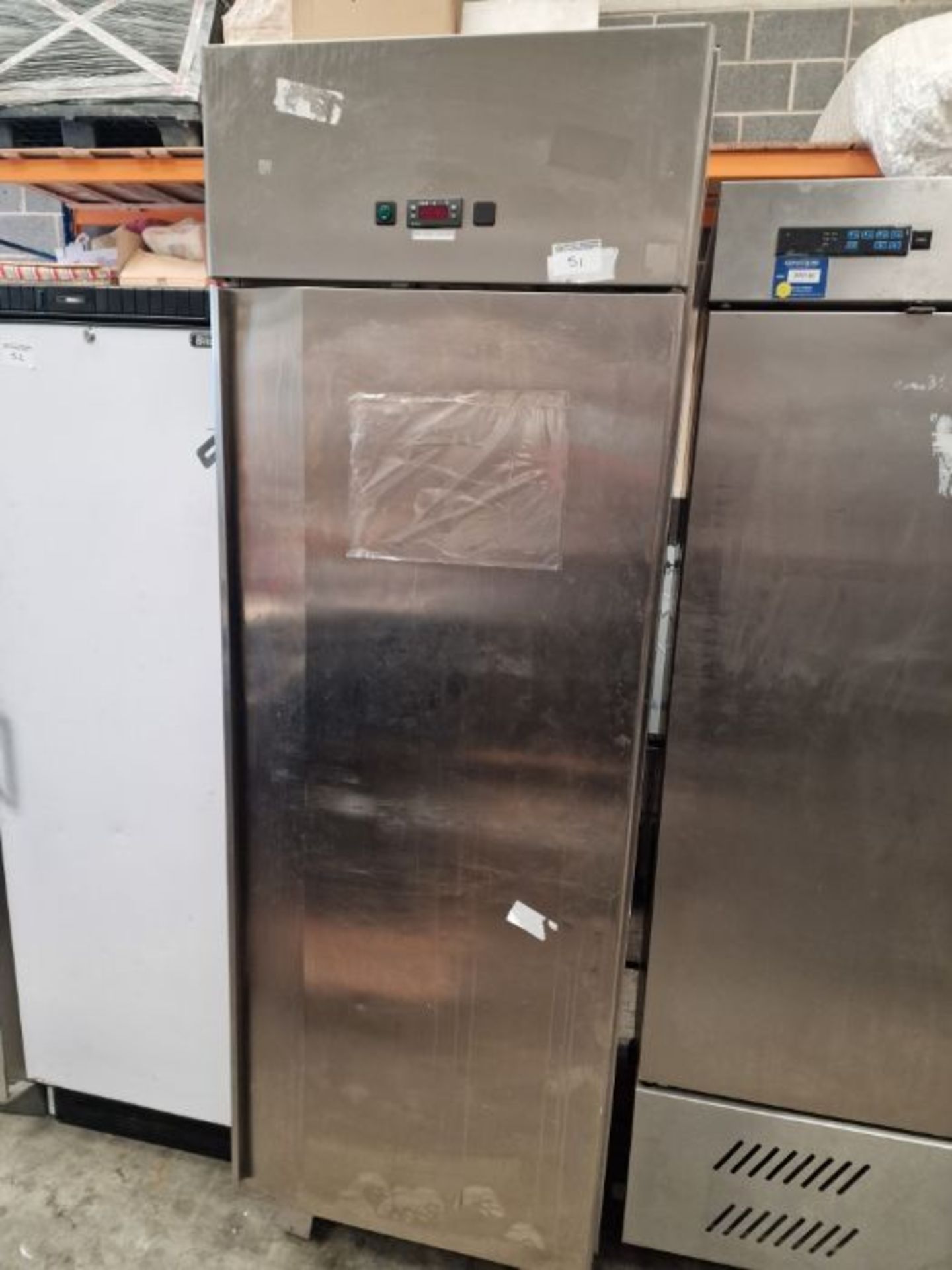 Large upright s/s fridge.