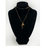 18CT GOLD CHAIN AND PENDANT & A HORN OF PLENTY CHARM