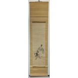 A JAPANESE KAKEMONO HANGING SCROLL SHOWS A FIGURAL SCENE IN WHICH A PROSPEROUS-LOOKING MAN