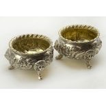 TWO HALLMARKED SILVER PRESERVE POTS WITH A SILVER SPOON