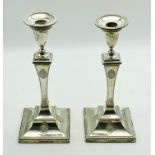 PAIR OF EARLY 20TH CENTURY HALLMARKED SILVER CANDLESTICKS