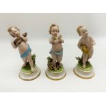 THREE EARLY STAFFORDSHIRE FIGURINES OF YOUNG CHILDREN