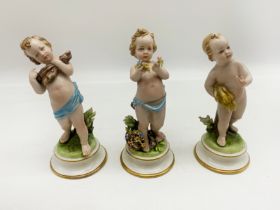 THREE EARLY STAFFORDSHIRE FIGURINES OF YOUNG CHILDREN
