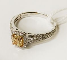 FANCY LIGHT YELLOW 0.50 CARAT DIAMOND RING WITH APPROX 1 CARAT OF DIAMONDS TO SHOULDERS