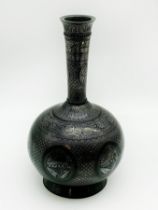 A SILVER INLAID INDIAN BIDRI WARE VASE WITH FINELY EXECUTED OVERALL FLORAL LEAF DECORATION