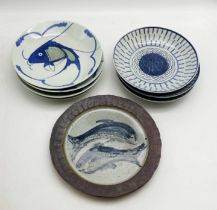 A GROUP OF CHINESE BLUE AND WHITE DISHES, FOUR OF WHICH DEPICT A LEAPING CARP MOTIF A/F