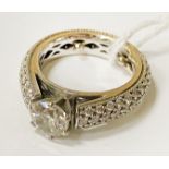 0.90 POINTS ROUND CUT DIAMOND RING WITH DIAMONDS TO THE SHOULDER IN 18CT WHITE GOLD - CONTEMPORARY