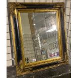 BLACK AND GILT FRAMED BEVELLED MIRROR - 68 X 58 CMS APPROX