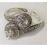 18CT GOLD 1.5 CARAT APPROX TOTAL EACH CENTRE STONE IS 0.5CTS EACH APPROX RING - SIZE P