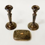 HM SILVER CIGARETTE BOX WITH PAIR OF SILVER WEIGHTED CANDLESTICKS BOX WEIGHS 3OZ APPROX CANDLESTICKS