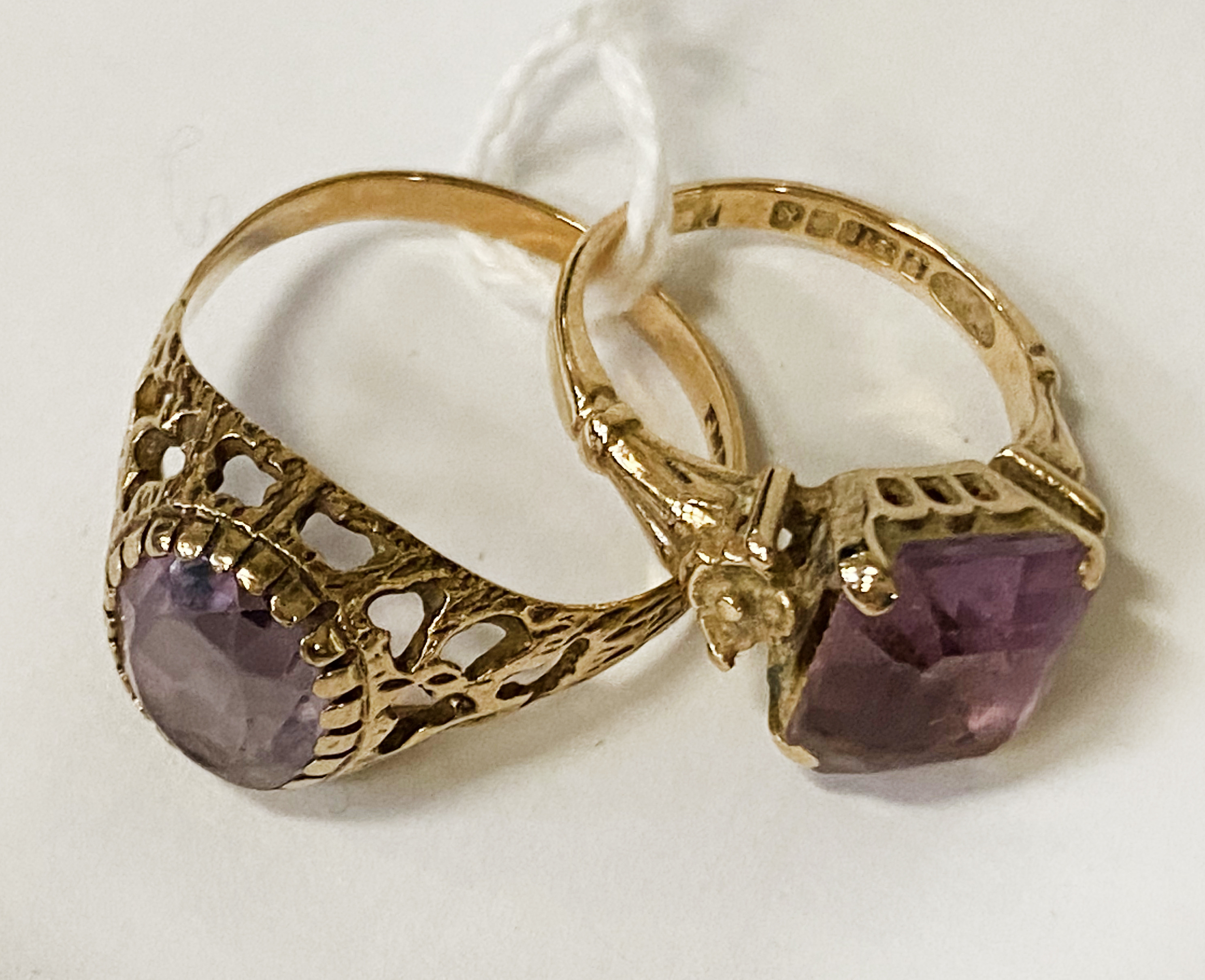 TWO 9 CT. GOLD AMETHYST RINGS