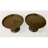 BRONZE TAZZAS WITH MIRROR IMAGES OF FIGURE HEADS 14CMS (H) APPROX