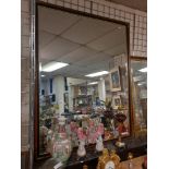 LARGE BEVELLED MIRROR WITH BRASS CORNERS