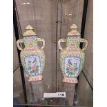 2 ENAMELED FAMILLE ROSE LIDDED URNS - 23CMS TALL