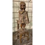 BRONZE CHILD ON A CHAIR 43CMS (H)