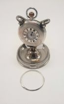 HM SILVER HALF HUNTER POCKET WATCH ON METAL STAND WITH A METAL BEZEL