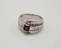 18CT GOLD RUBY & DIAMOND CROSSOVER RING - SIZE K