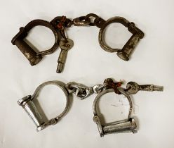 TWO PAIRS OF OLD HANDCUFFS