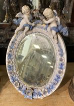 EARLY PORCELAIN CHERUB TABLE MIRROR