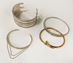 THREE SILVER BANGLES WITH ANOTHER NOT SILVER