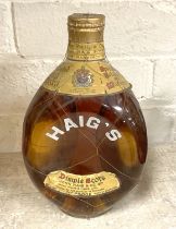 EARLY BOTTLE OF DIMPLE HAIG WHISKEY