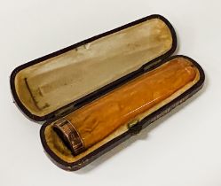 9CT GOLD RIMMED AMBER CIGAR HOLDER