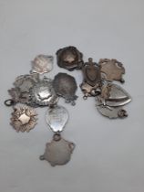 COLLECTION OF SILVER FOB SHIELDS