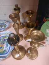 THREE PAIRS OF BRASS CANDLESTICKS