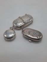 THREE STERLING SILVER COIN HOLDERS/VESTA CASES