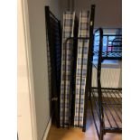 A childs metal bunk bed frame, white legs with a black frame, to include two single mattresses Stock