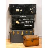 Two early 20th century metal deed boxes, together with a brass bound traveling trunk, and a