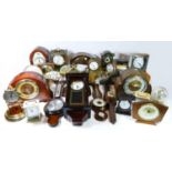 A collection of mid 20th century and later mantel clocks, wall clocks and barometers, having
