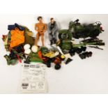 An extensive collection of Action Man accessories, including rifles, hand guns, grenades, boots,