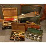 A large metal trunk and contents, to include carpenters hand tools in three tool chests.