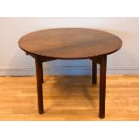 A Georgian mahogany drop leaf table, circular, 120cm diameter, 72cm tall