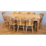 A country kitchen style pine dining table, 180cm x 80cm x 107cm, on tapered legs, together with a