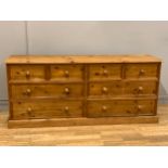 A stained pine chest of drawers, four small drawers over two sets of long drawers, button handles,