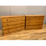 A matching pair of drawers, stained pine, four long drawers of the same length, button handles,