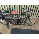 A Flying Pigeon motorised bicycle, unregistered, with luggage rack, pannier and rear stand. The