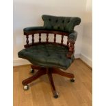 A mahogany framed green leather button back captain's chair by Ring Mekanikk, Norway, with swivel